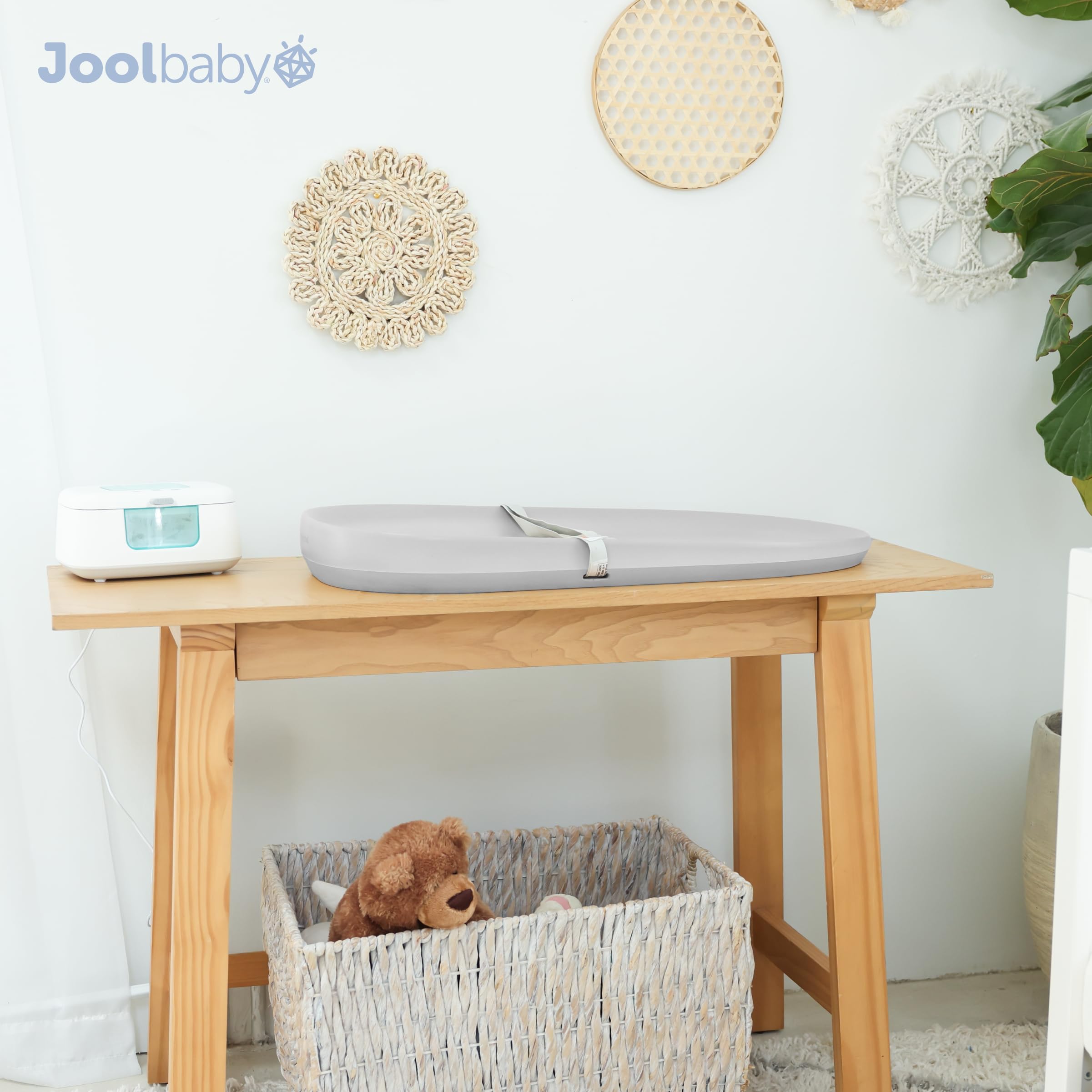 Jool Baby waterproof changing pad gray portable lightweight for home and travel use.