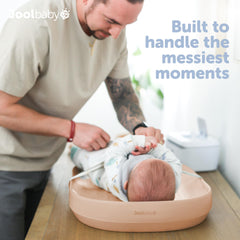 jool baby peach changing pad surface is wipe-clean for quick mess cleanup