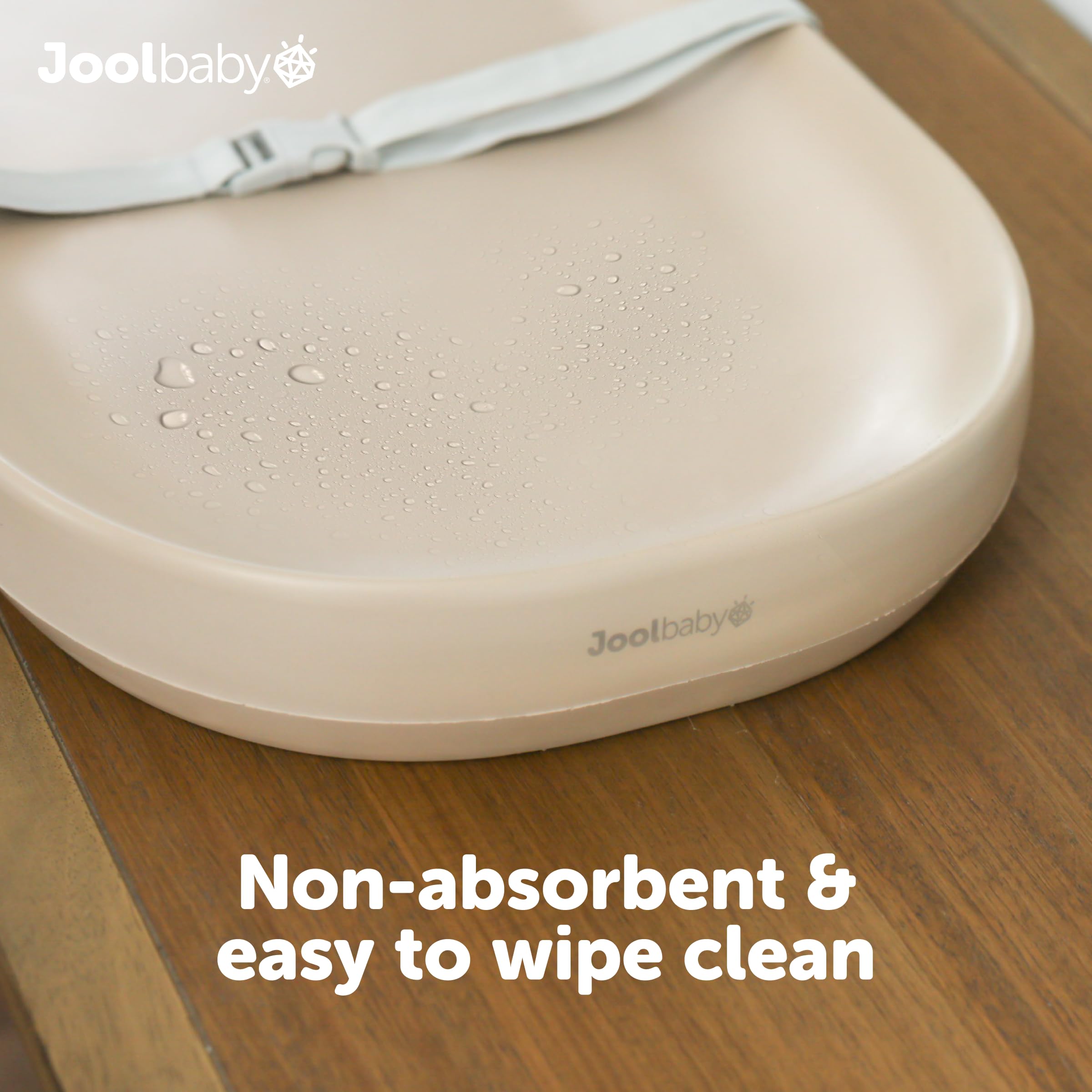 Jool Baby waterproof pad shows raised sides for secure diaper changes