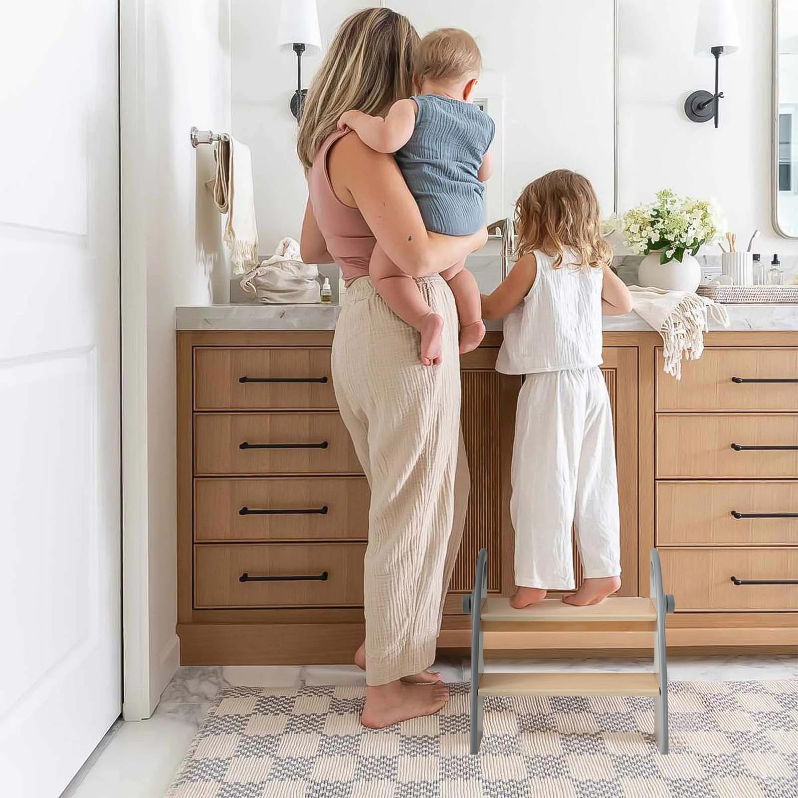 Joothlin wooden 2-step stool folds flat to save space in a bathroom or bedroom.