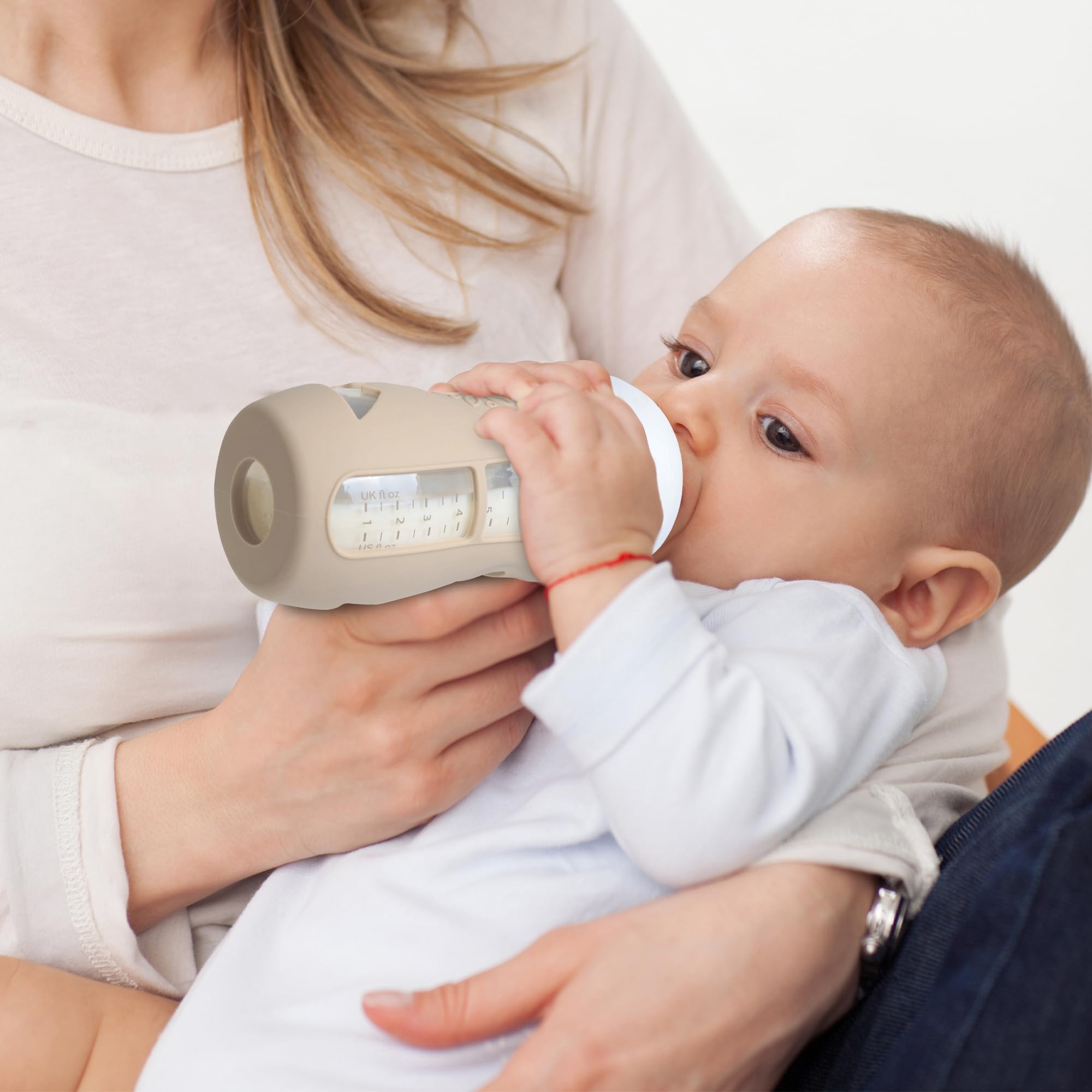 Joxodak grip-friendly sleeve for Philips Avent 8oz bottle, clear view milk scale remains visible.
