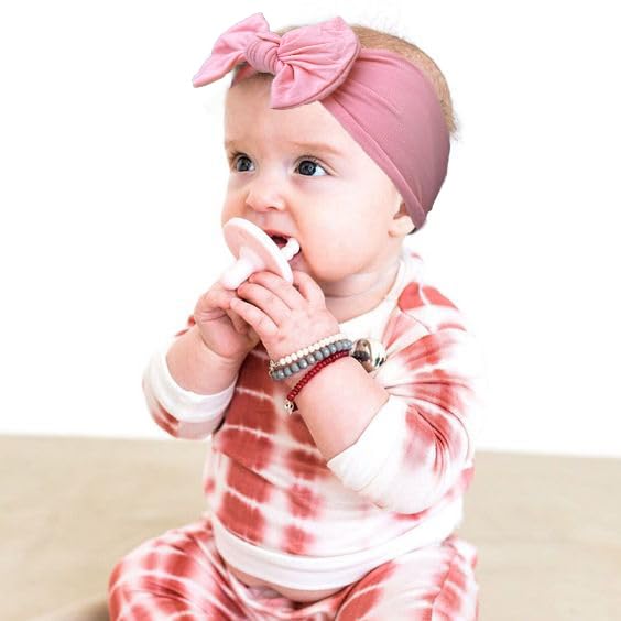 JOYOYO headbands on a baby girl showing comfortable wear during play