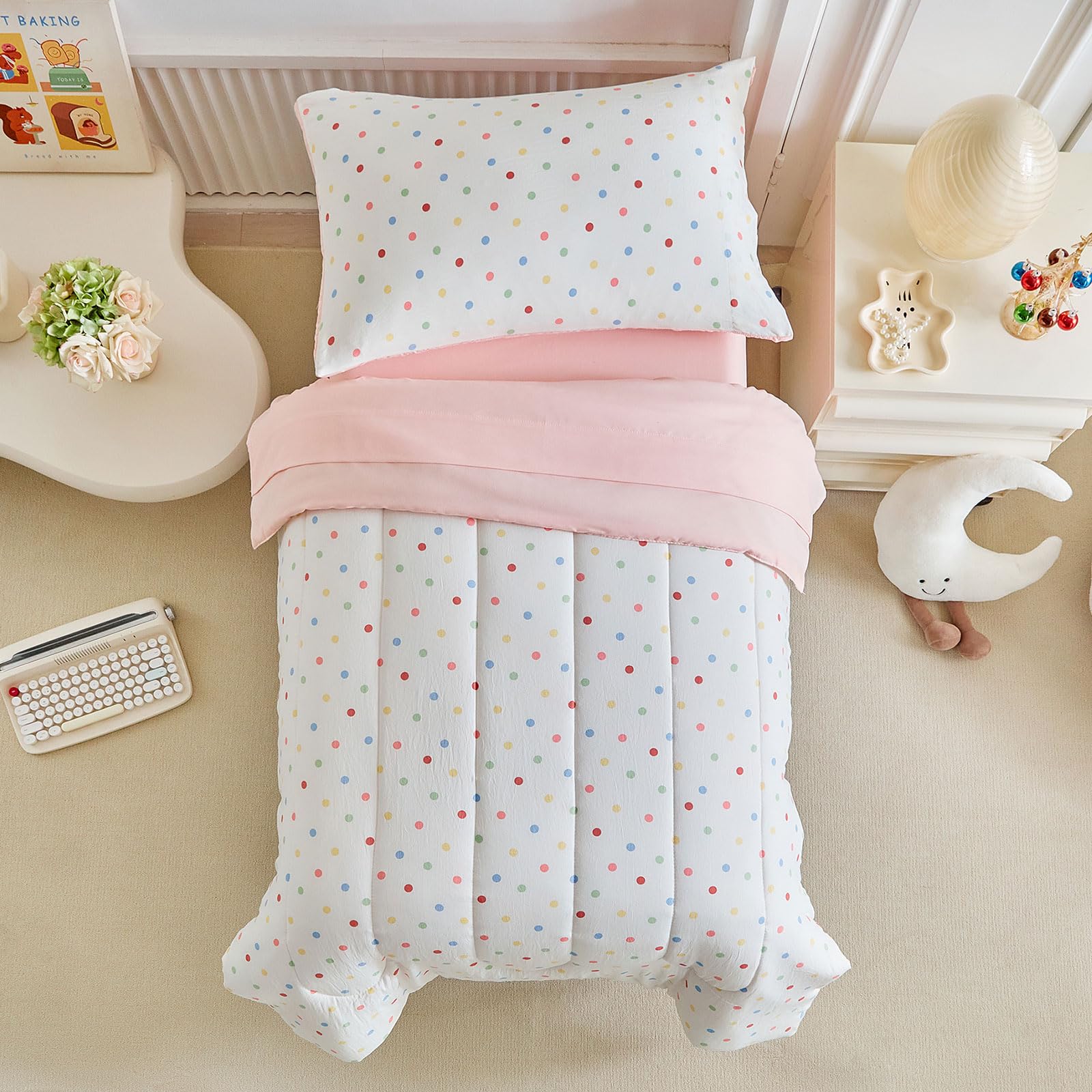 Joyreap polka dots pink-white reversible comforter provides cozy sleep for toddlers.