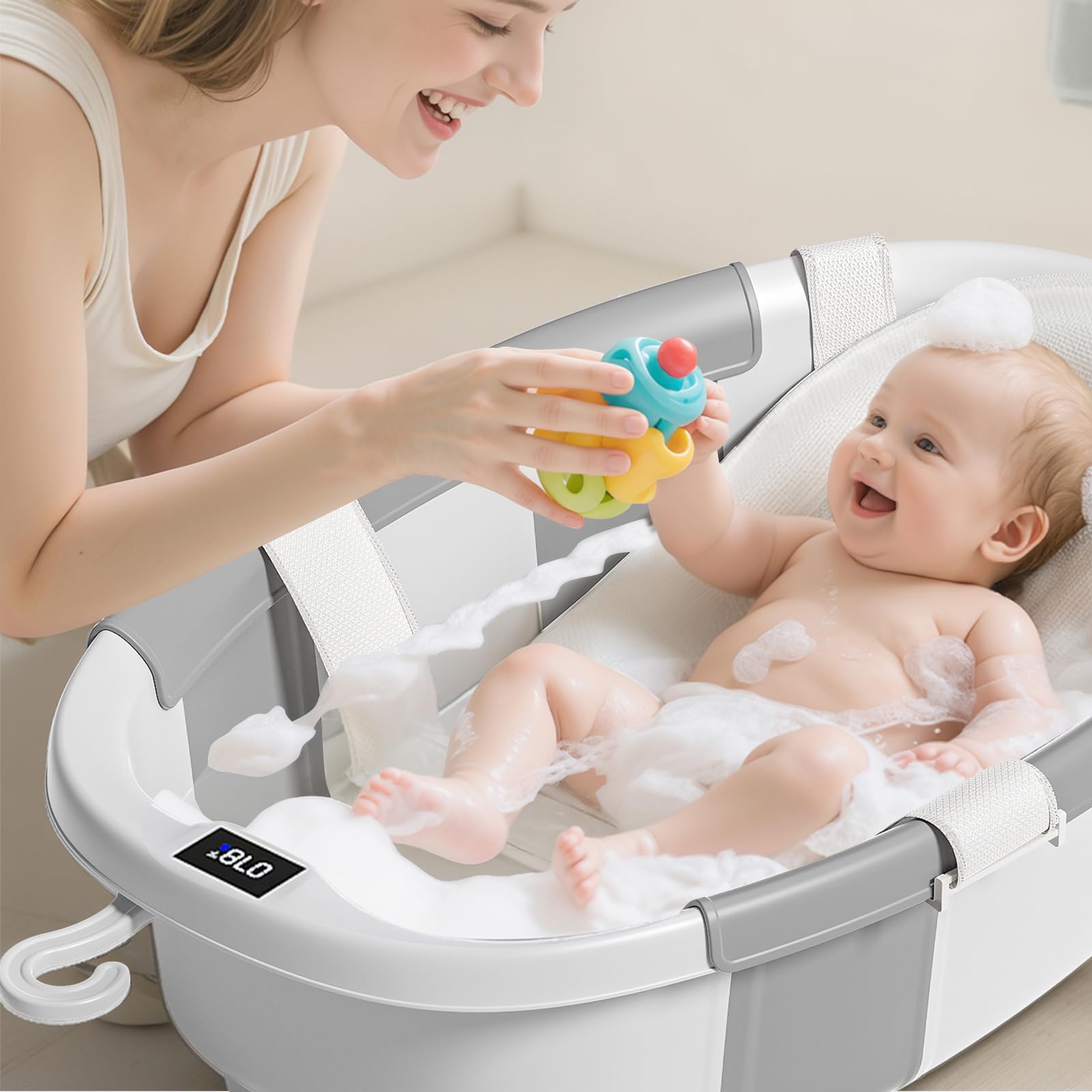 JoyYum collapsible baby bathtub in use with adult supervision, stable and comfy.