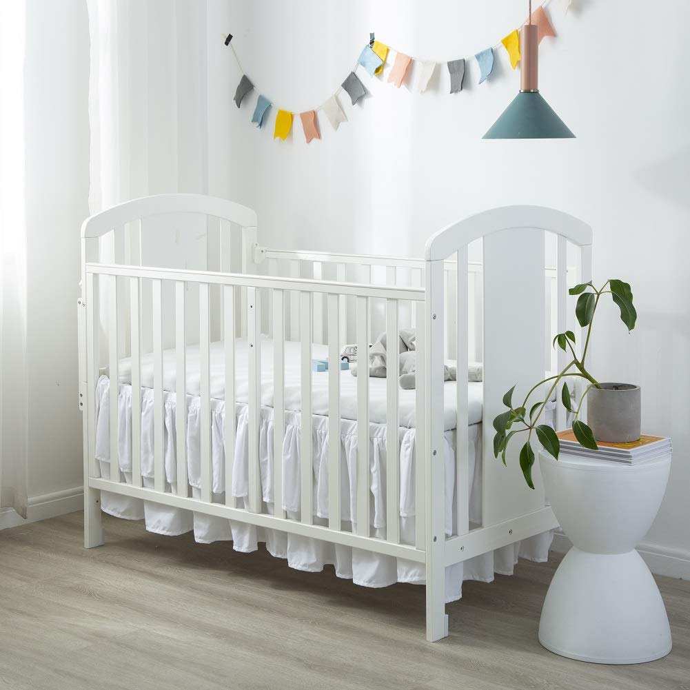 JSD crib skirt available in pink, white, and grey to match decor.