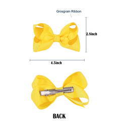 JUCCPUL yellow bow clipped in a baby girl's hair for cheerful charm.