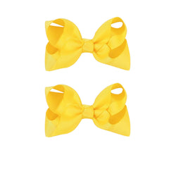 JUCCPUL yellow 4.5-inch bow on an alligator clip for secure toddler hairstyles.