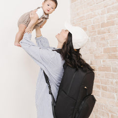 JuJuBe Deluxe Diaper Backpack insulated bottle pocket with flexible sizing.