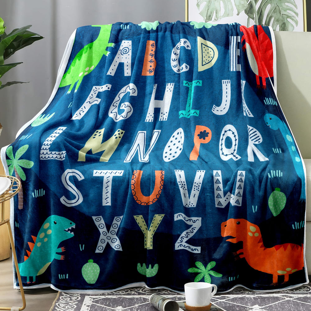 Jurllyshe ABC Blanket with blue dinosaurs, cozy kids' blanket for playtime.