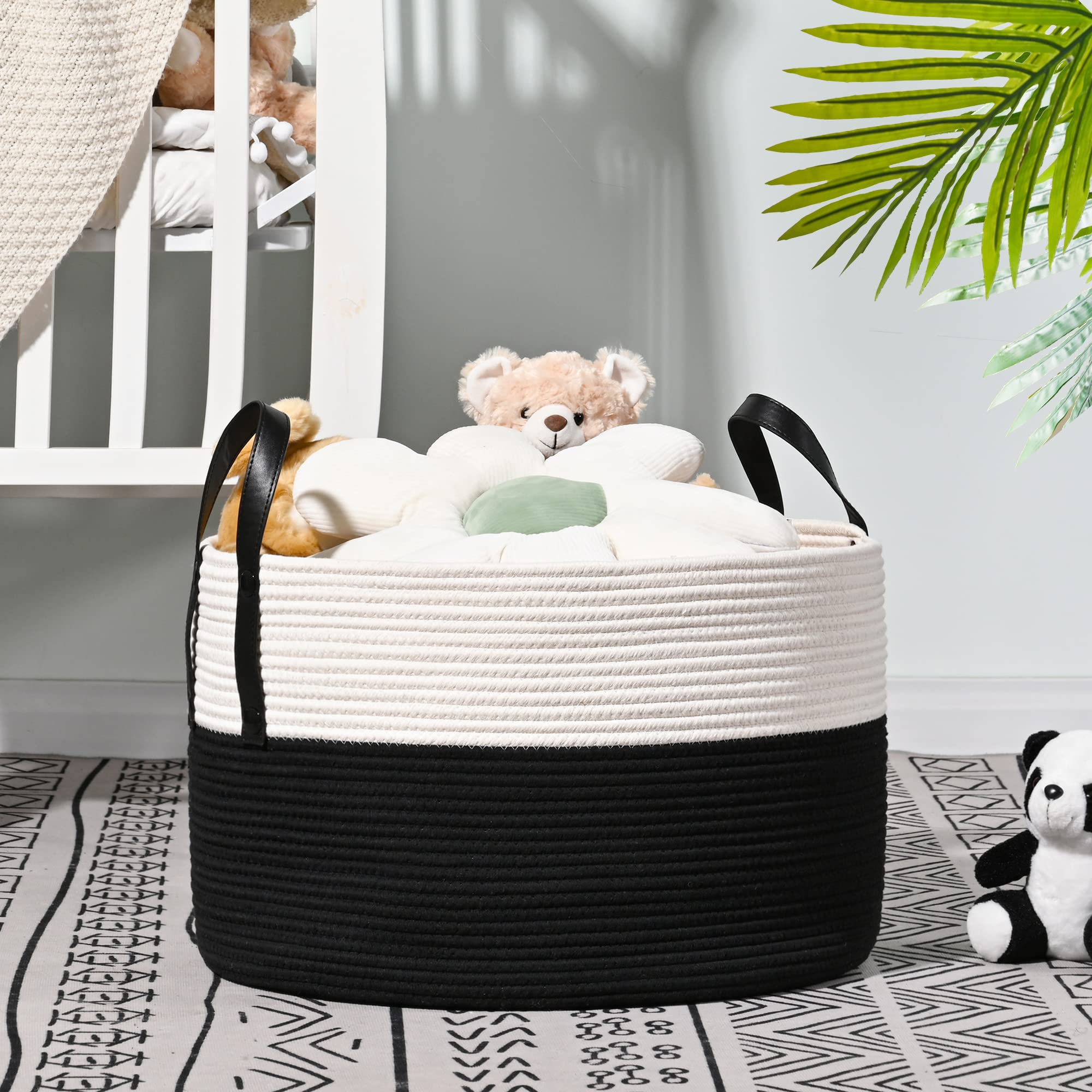 KAKAMAY blanket basket in white and black adds contrast while organizing nursery items.