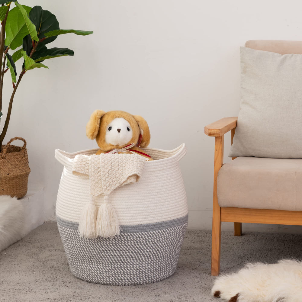 KAKAMAY blanket and pillow basket grey adds style and organization to a sofa.