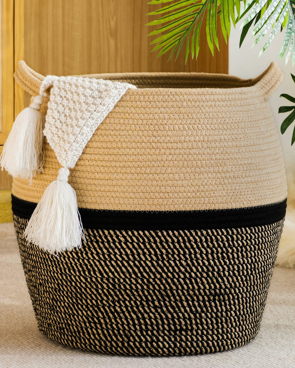 KAKAMAY woven basket stores blankets neatly for living room.