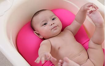 KAKIBLIN infant bath time scene with cushioned edge support.