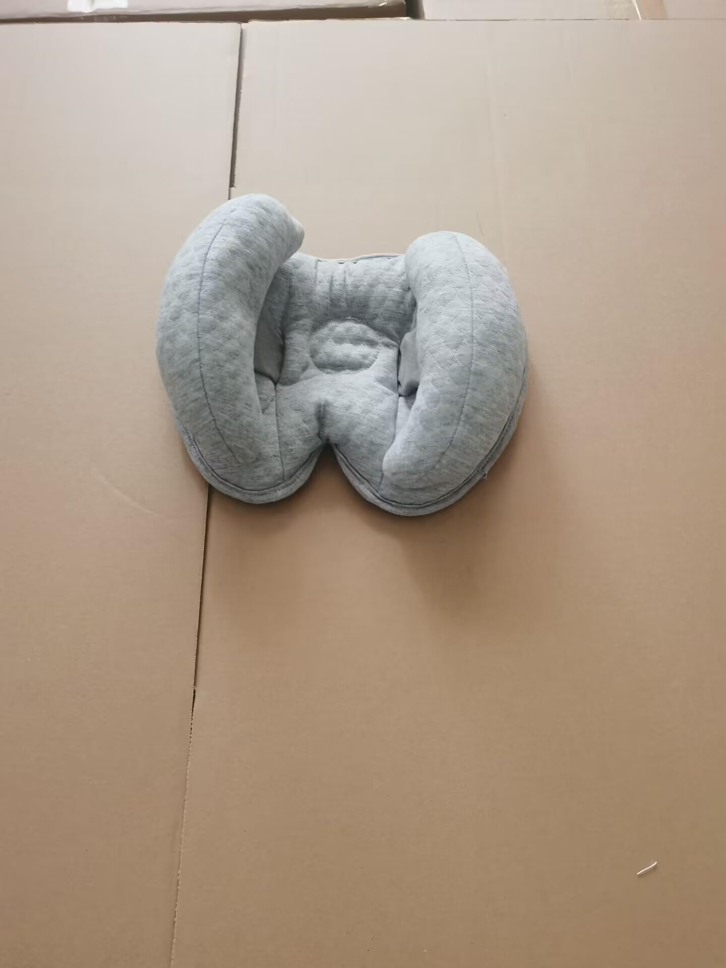 KAKIBLIN compact lightweight travel pillow gray ideal for car seats and strollers.