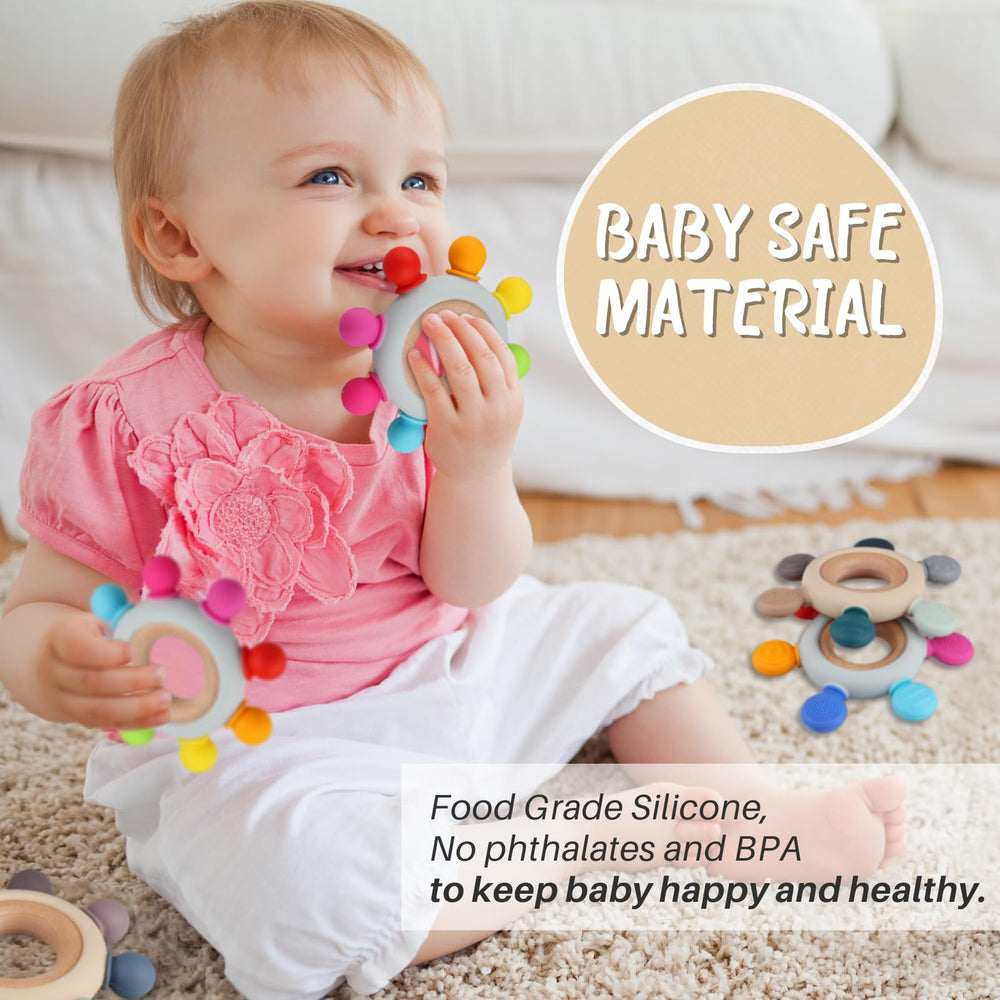 Kalovin baby teether held by baby hands showing easy grip