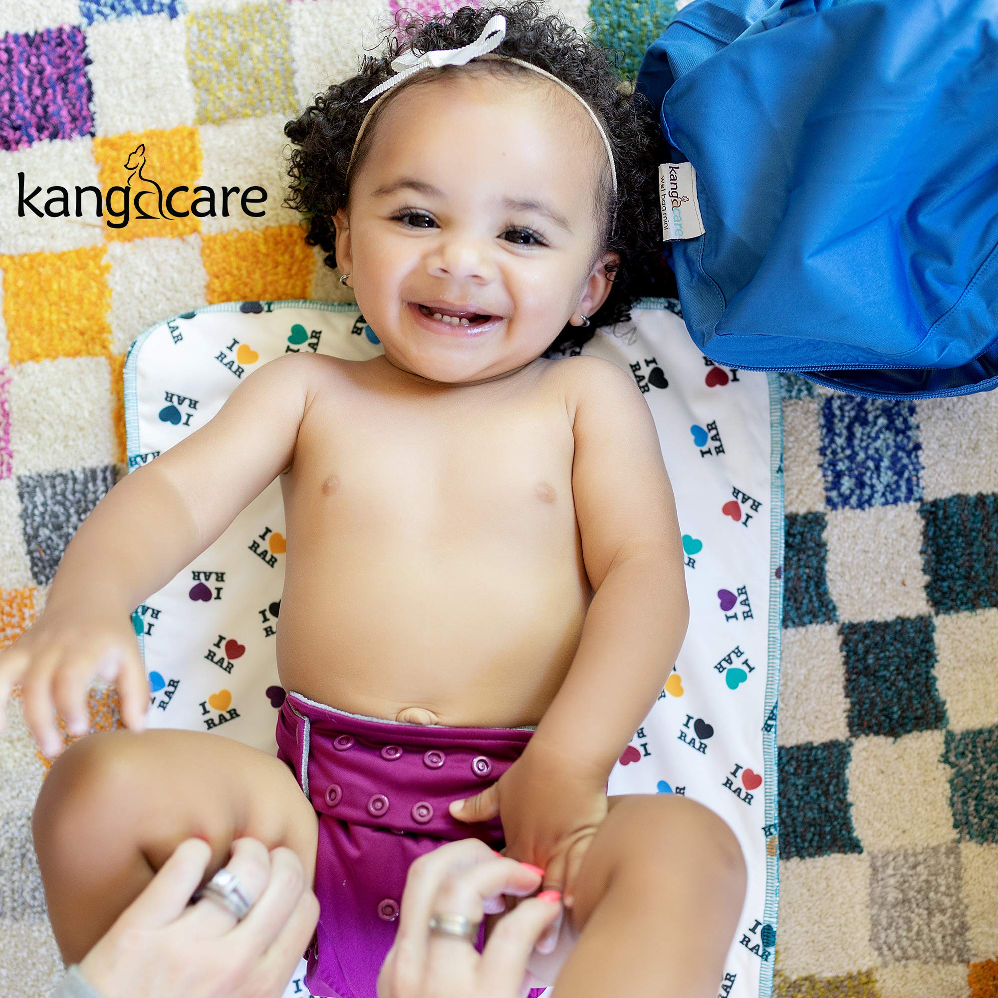 Kanga Care Clover multi-use scenarios including burp cloth and travel surface