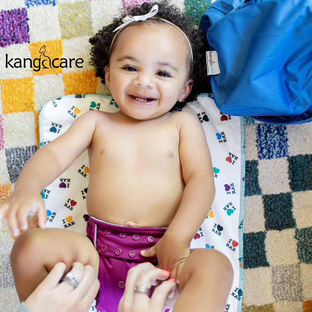 Kanga Care Clover multi-use scenarios including burp cloth and travel surface