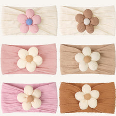 Kangaroo 6pcs baby flower headbands close-up, pastel flowers ideal for photos.
