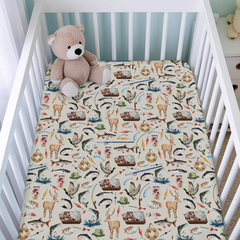 KASTLEE green animal-print crib sheet adds cozy softness to baby’s nursery