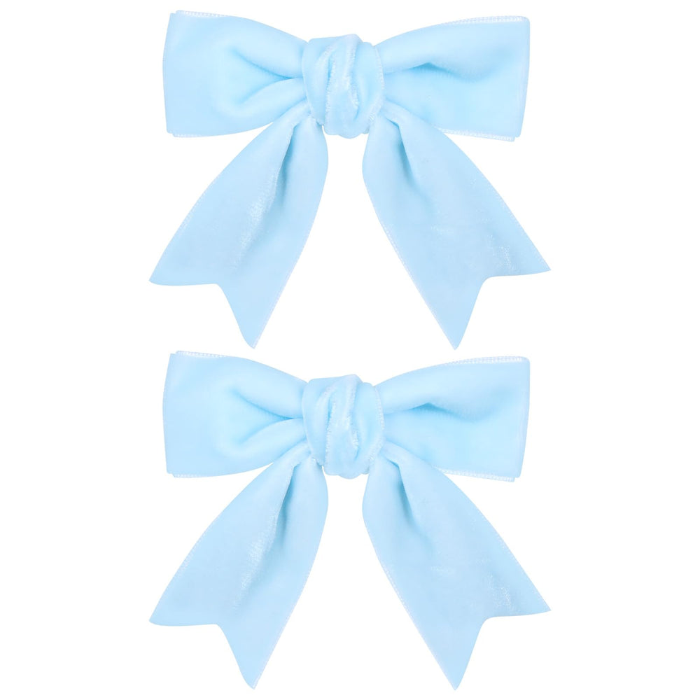 KCHIES 3in velvet bow light blue clipped on hair for secure all-day wear.