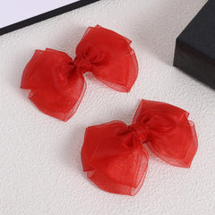KCHIES red mesh bow clip—side view highlighting secure alligator clip.