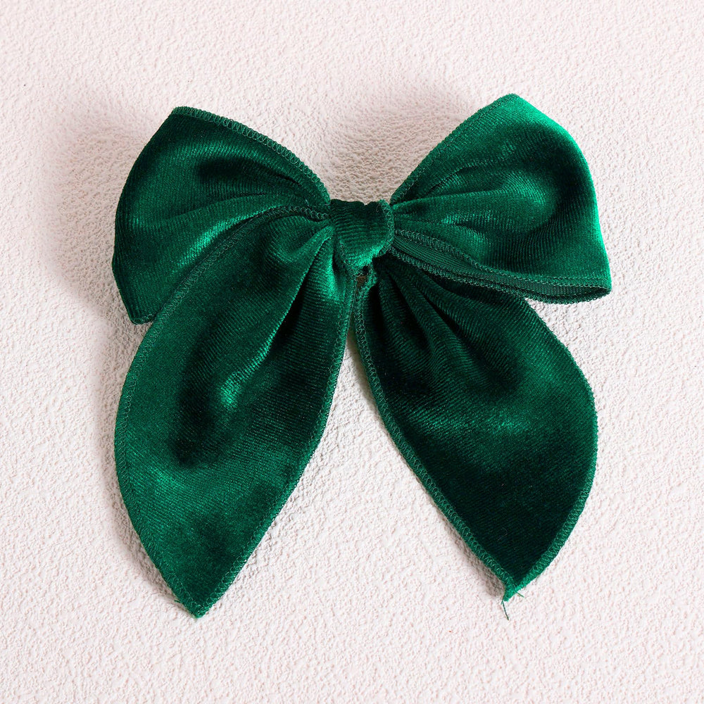 KCHIES 5-inch velvet bow hair clip shows strong grip for all hair types.