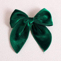 KCHIES 5-inch velvet bow hair clip shows strong grip for all hair types.
