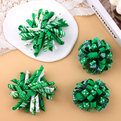 KCHIES Irish green and white grosgrain bow highlights a cute holiday look.