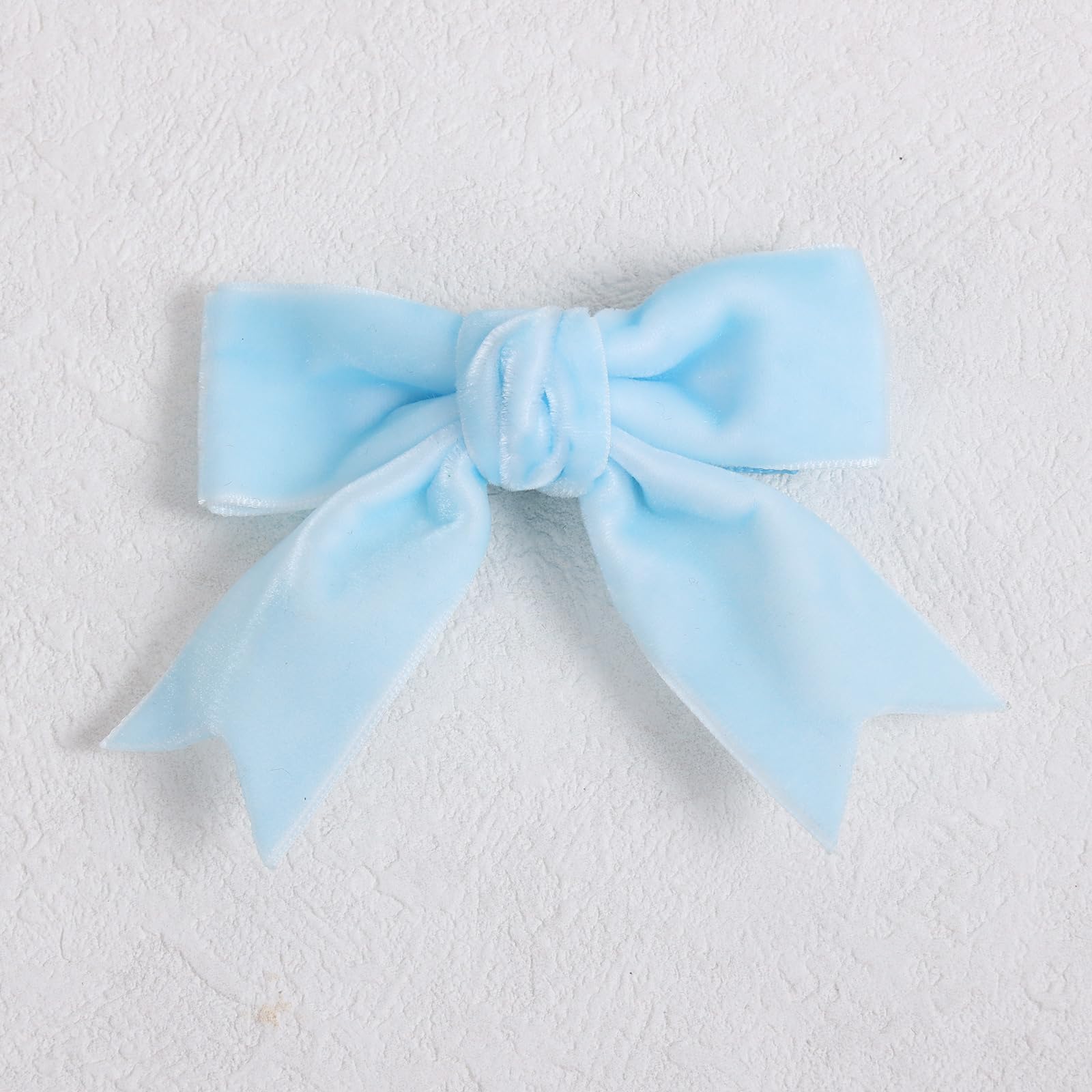 KCHIES velvet bow for kids and teens worn with outfits.
