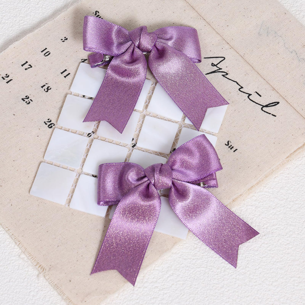 KCHIES purple glitter satin bow clip, side view, secure grip for thick or fine hair