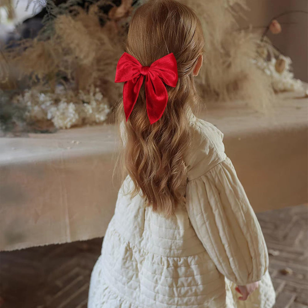 KCHIES red velvet bow closeup shows plush texture and premium finish.