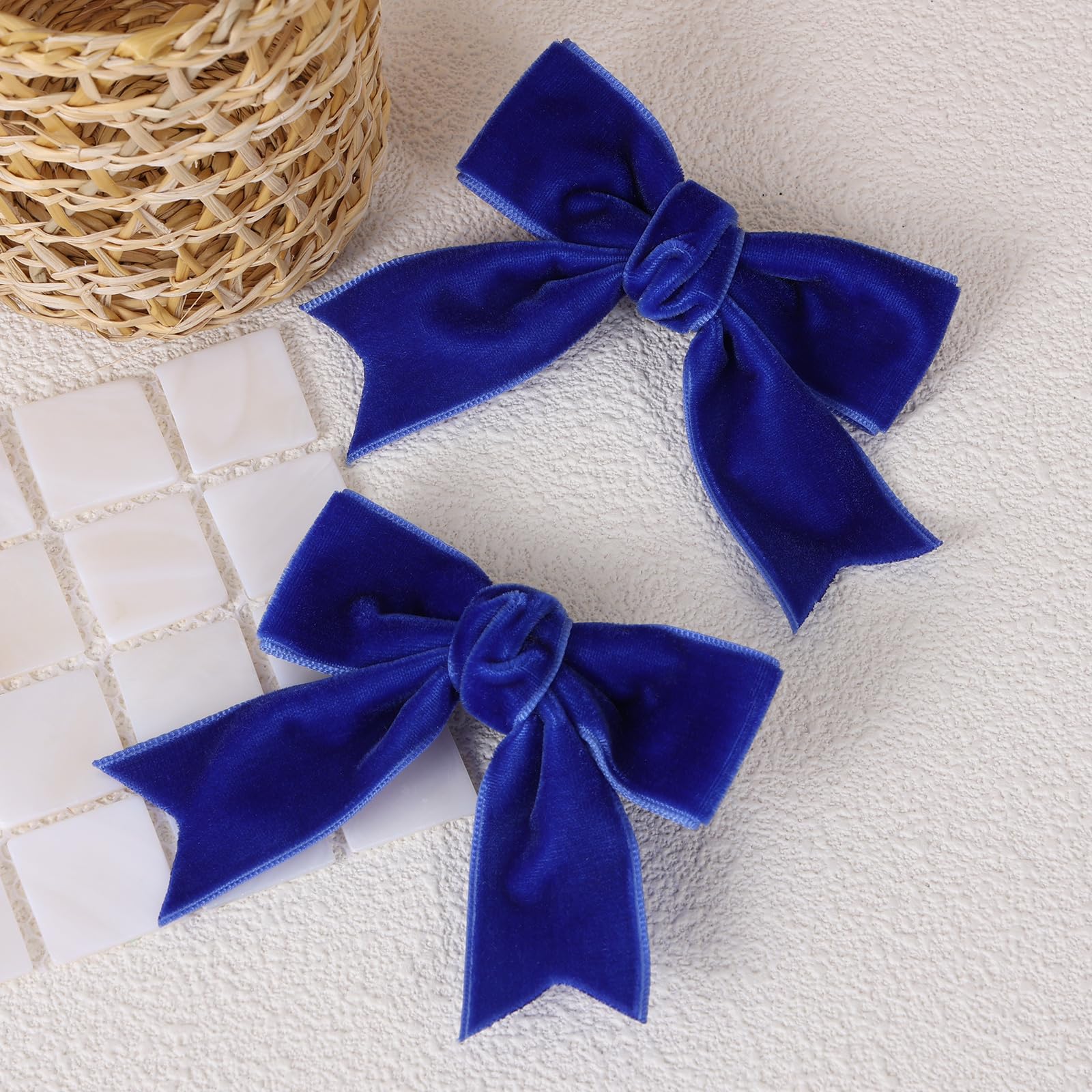 KCHIES royal blue velvet bow clip close-up showing soft texture and gentle grip
