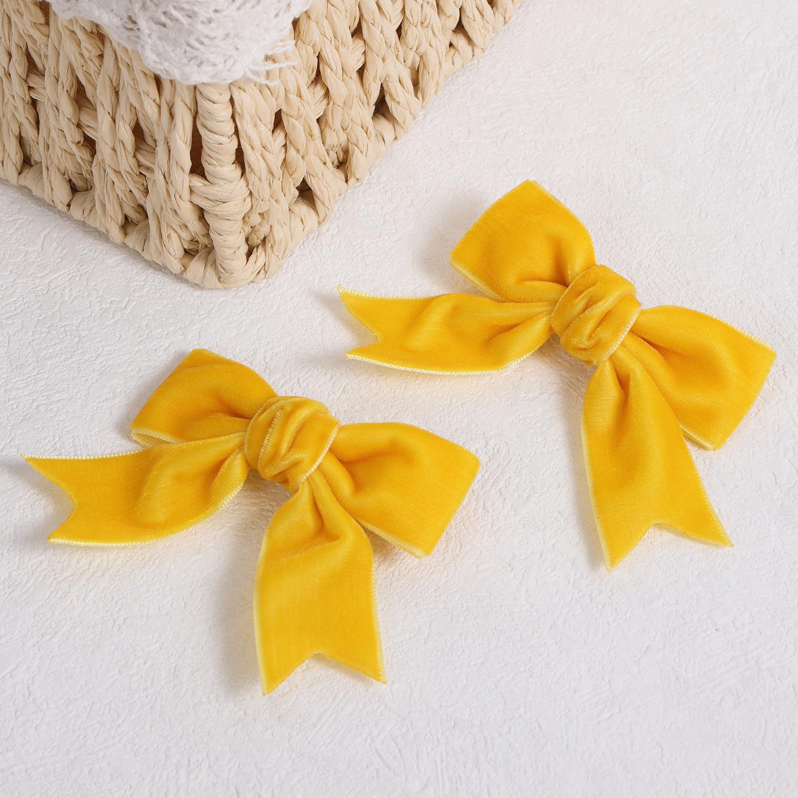 KCHIES velvet bow with alligator clip shown on hair for easy side-swept style.