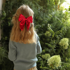 KCHIES velvet bow with alligator clip ensures secure hold through activities.