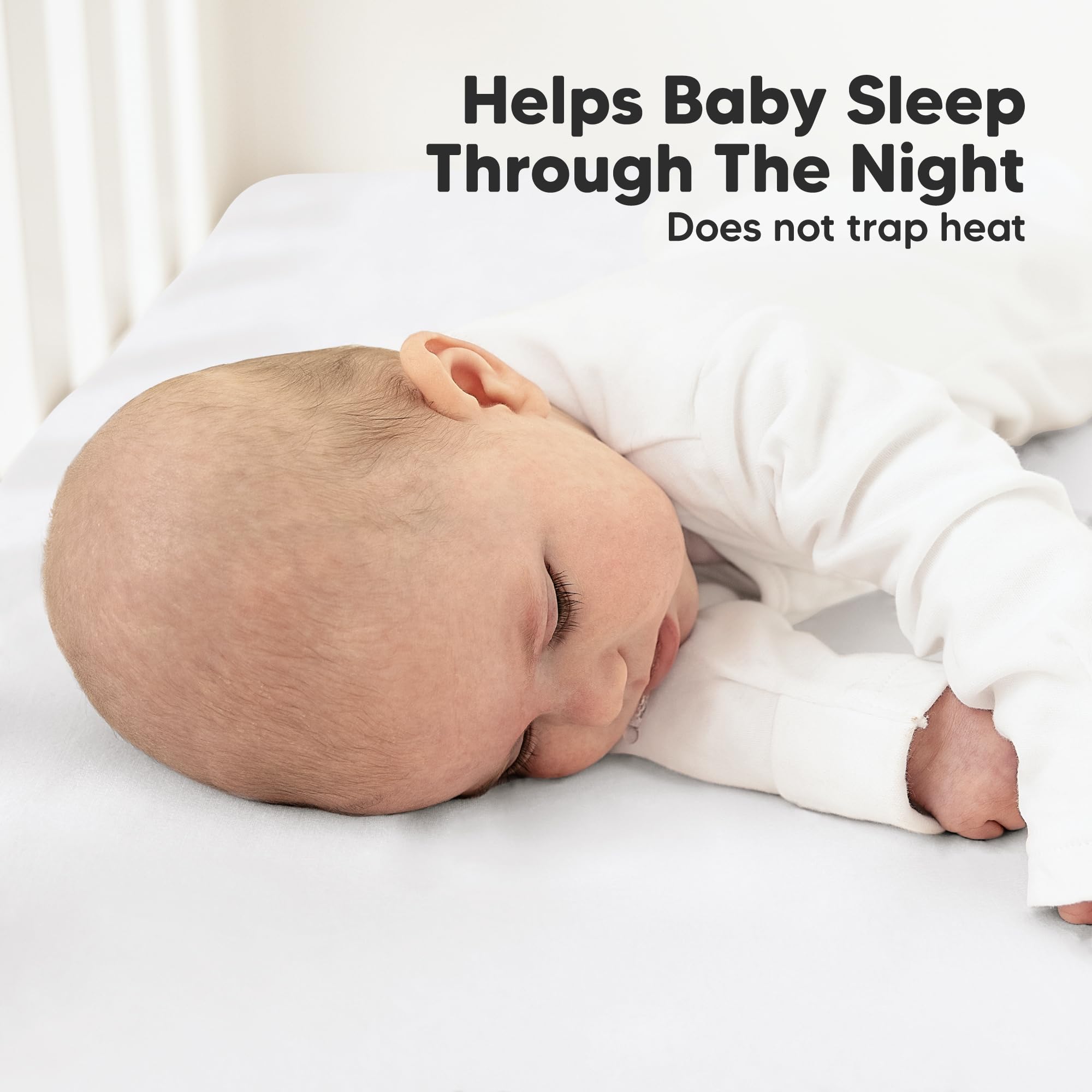 KeaBabies 2-Pack crib sheets rose snugfit band demonstrates secure placement.
