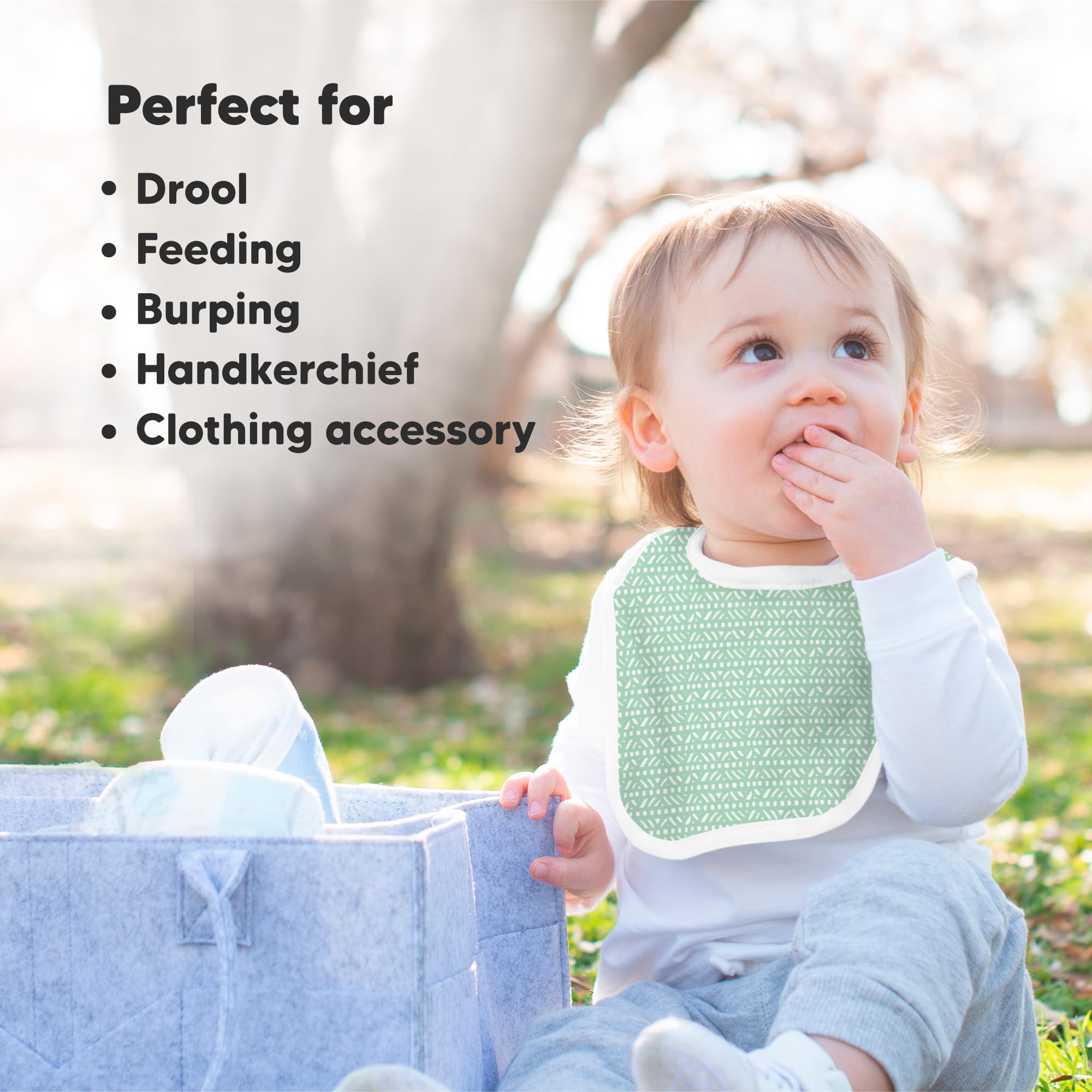 KeaBabies bib being wiped shows easy machine-wash care after spills