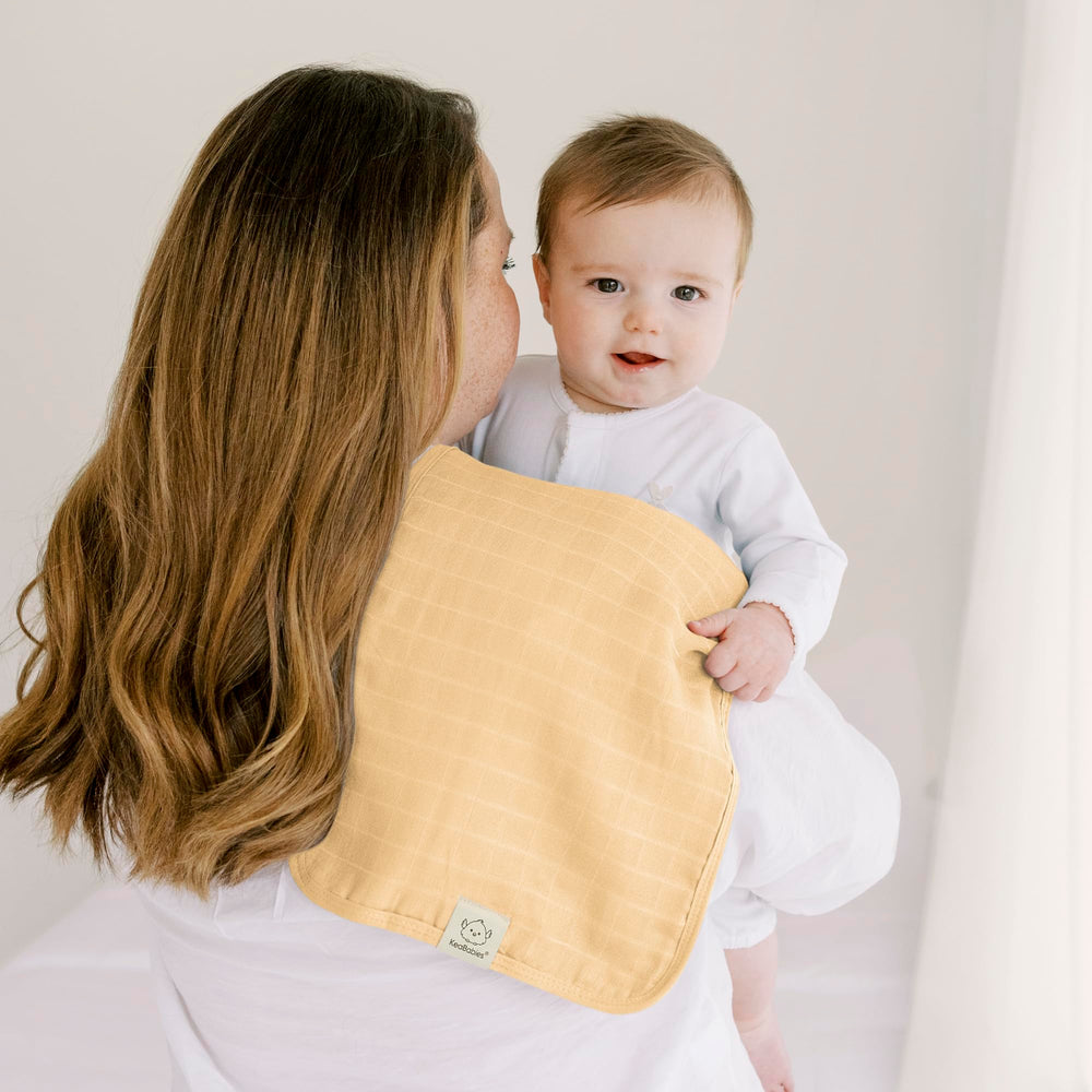 KeaBabies baby burp cloths in use for everyday messes.