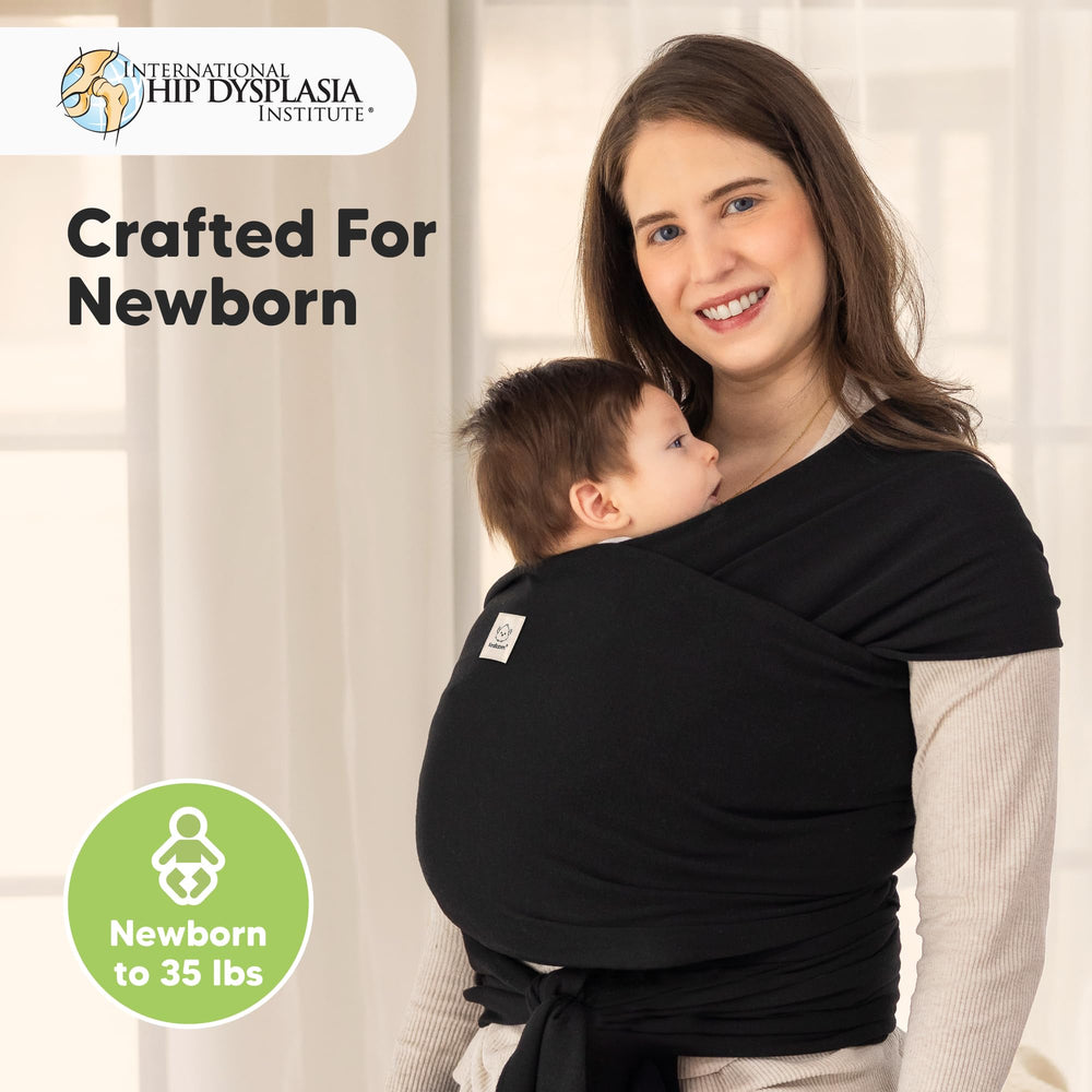 KeaBabies baby wrap carrier worn-shoulder illustrates comfortable ergonomic support during daily tasks.