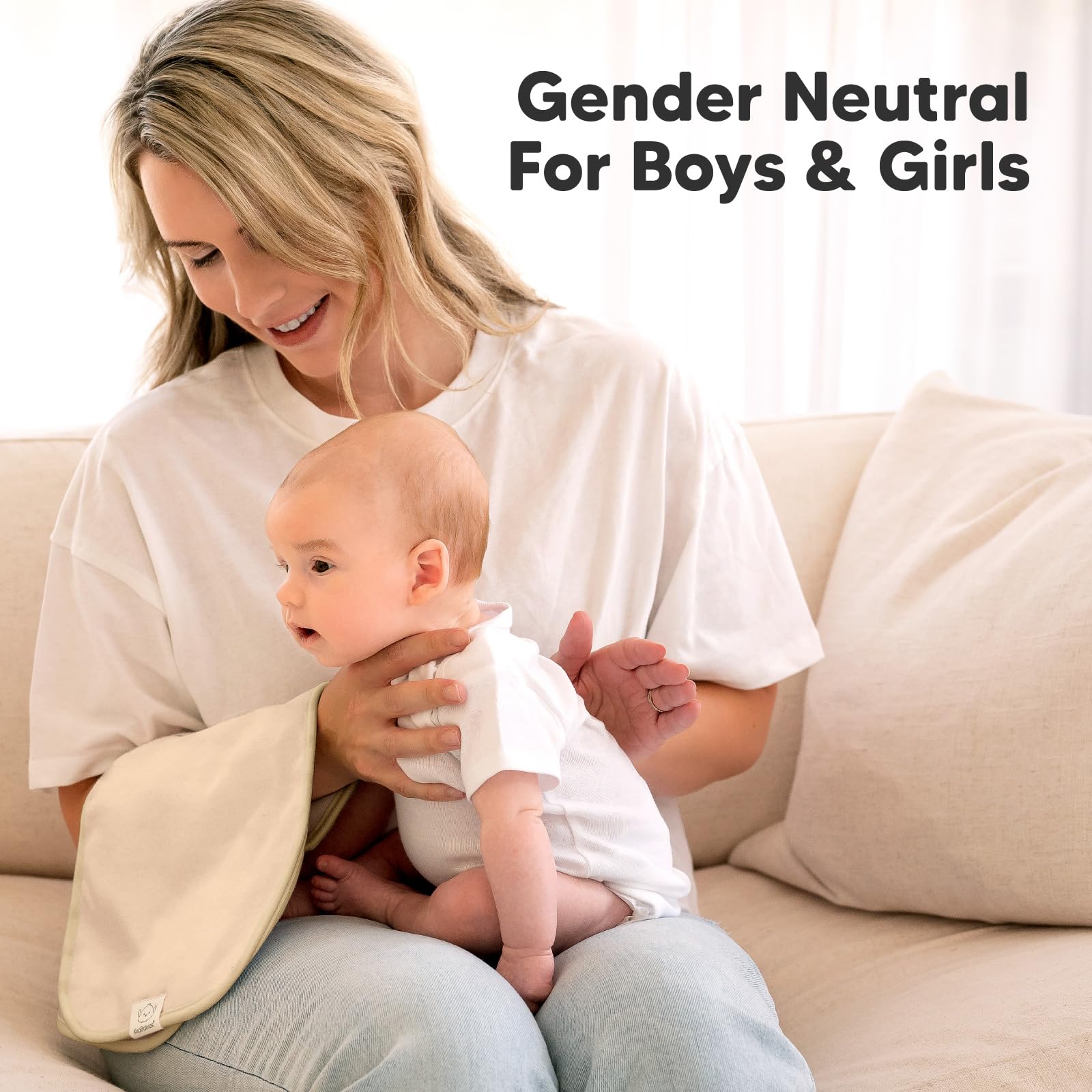 KeaBabies absorbent cloth in milk spit-up scenario—easy cleaning.
