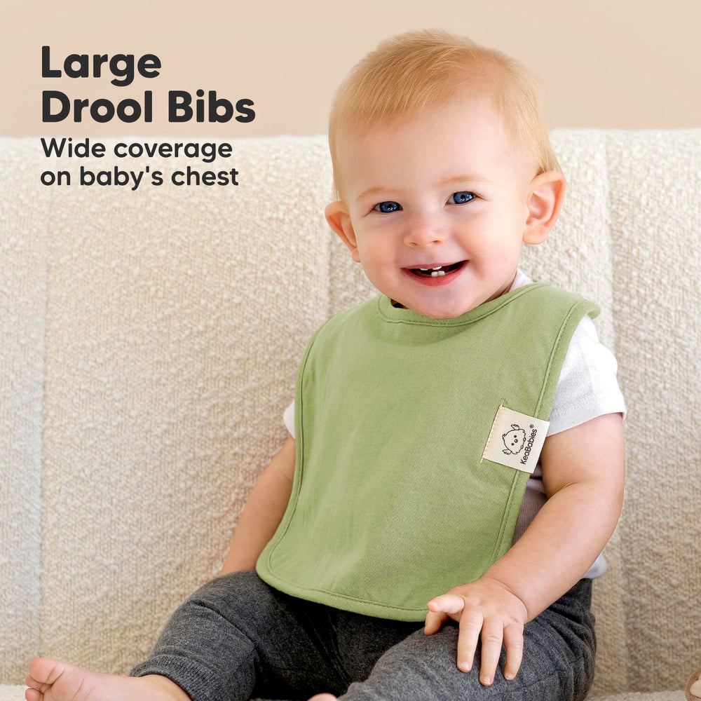 KeaBabies Coast bib with water-resistant back protecting clothes.