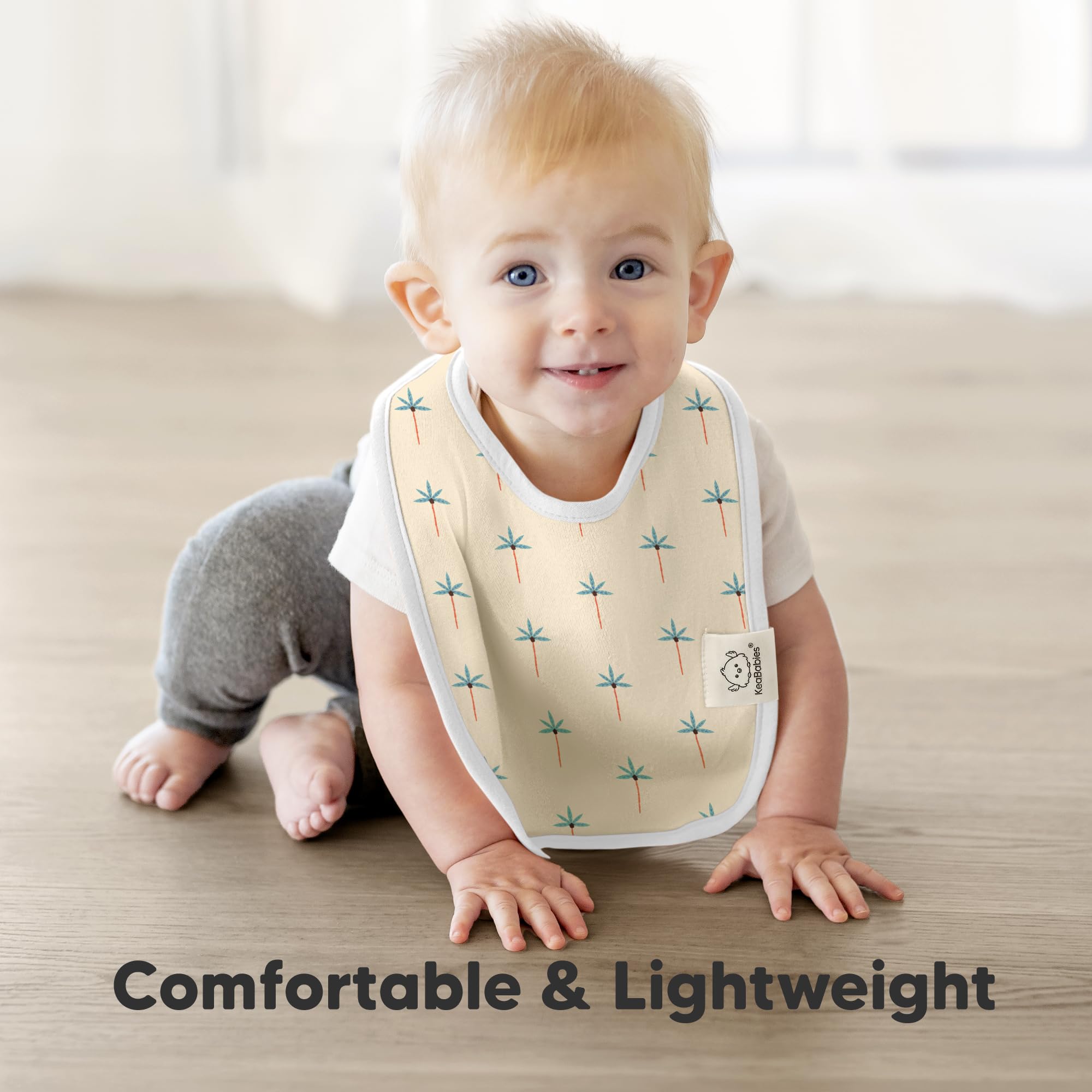 KeaBabies Coast Baby Bibs adjustable snaps demonstrate grow-with-baby fit.