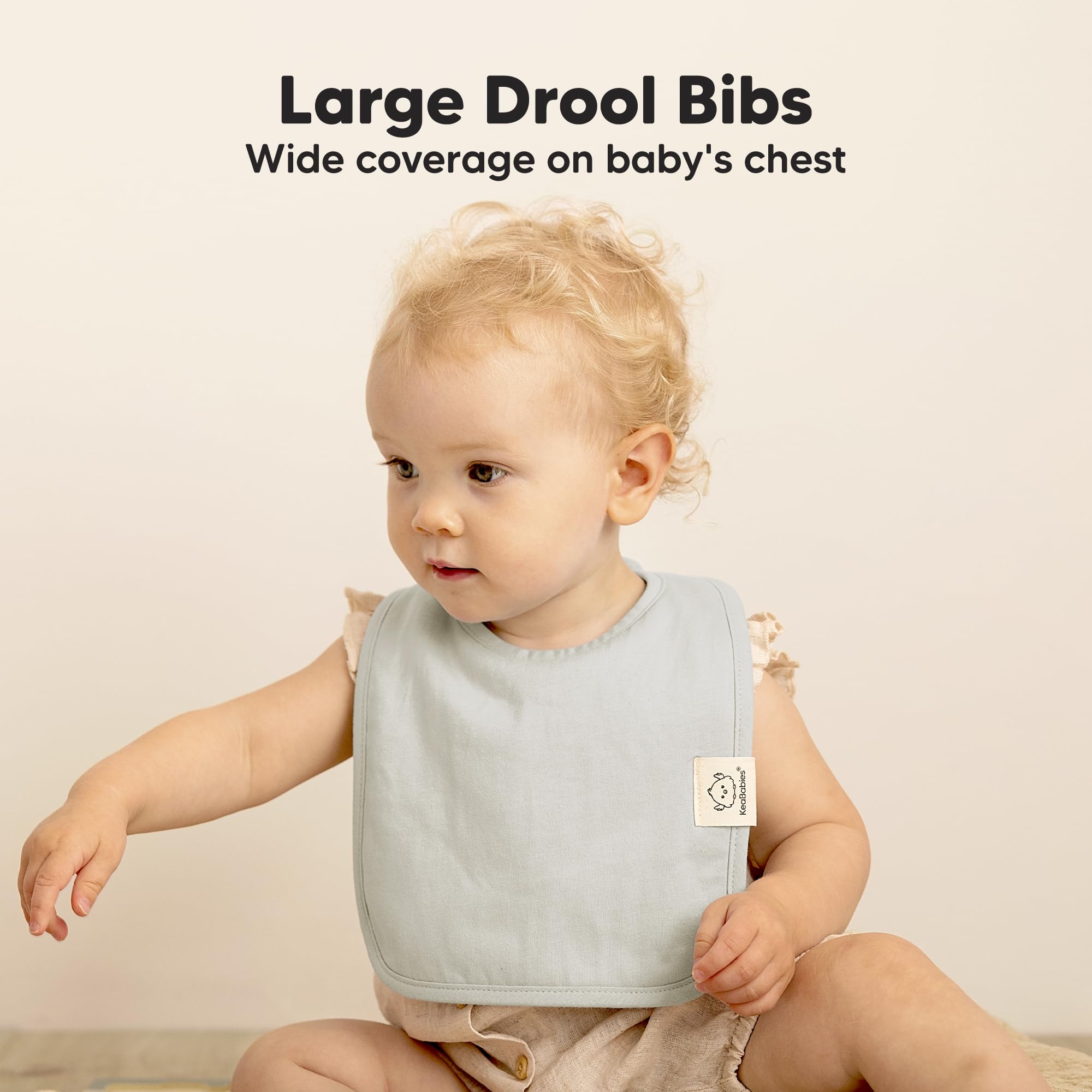 KeaBabies Coast bibs laid flat demonstrate large coverage for teething drool
