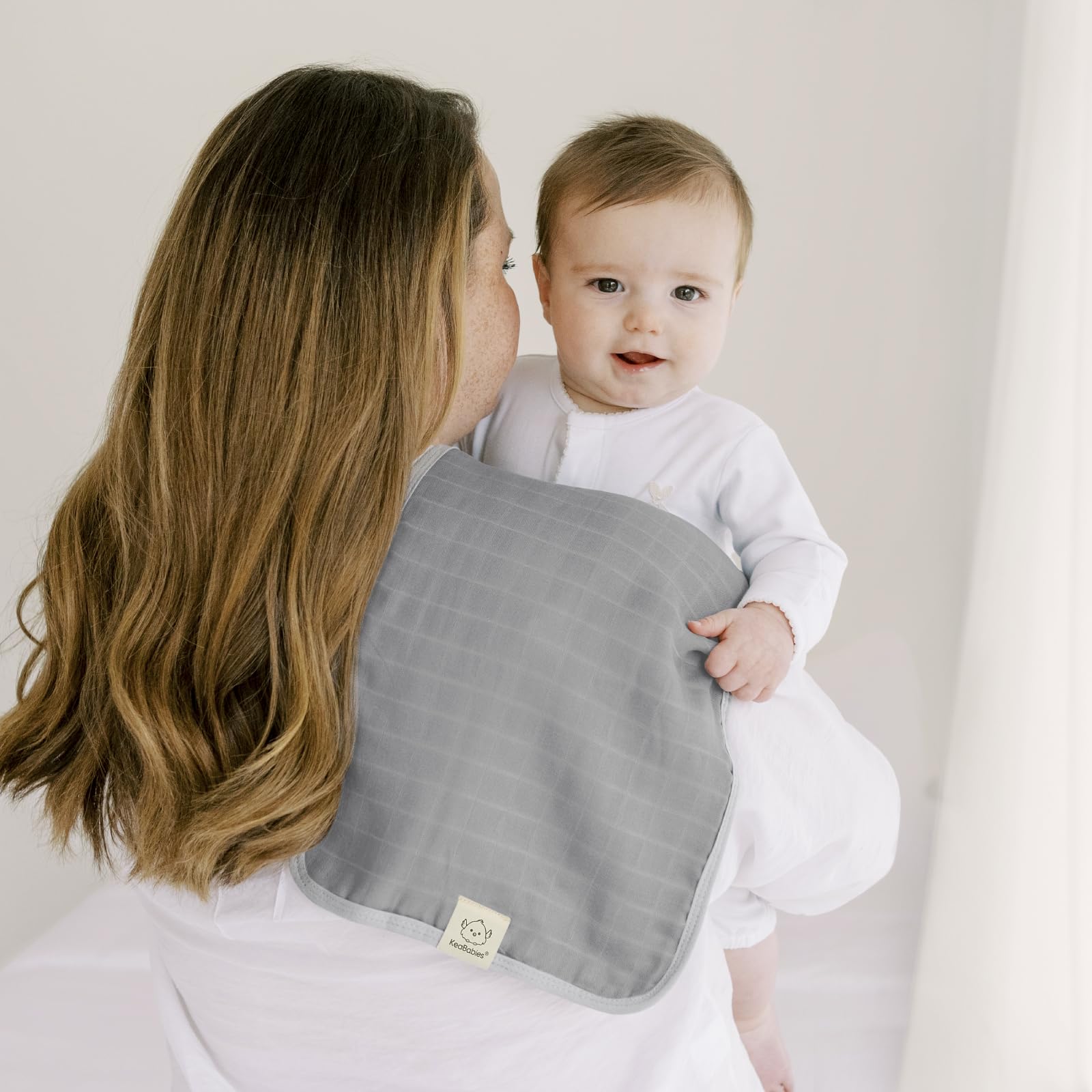 KeaBabies Coral 20x10 burp cloths displayed for versatile daily use.