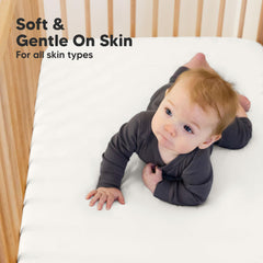KeaBabies crib sheet on mattress shows easy-fit feature for quick changes.