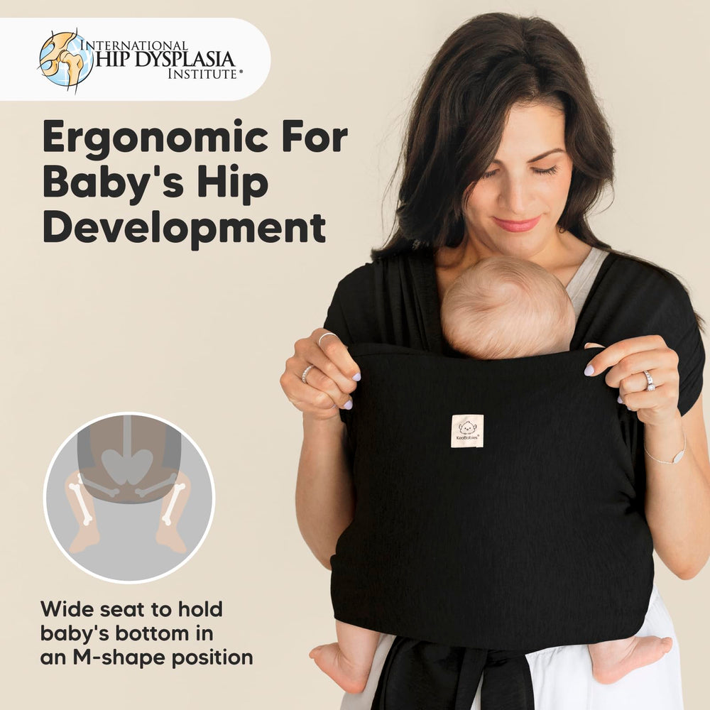 KeaBabies D-Lite wrap demonstrates newborn to toddler weight range in use.