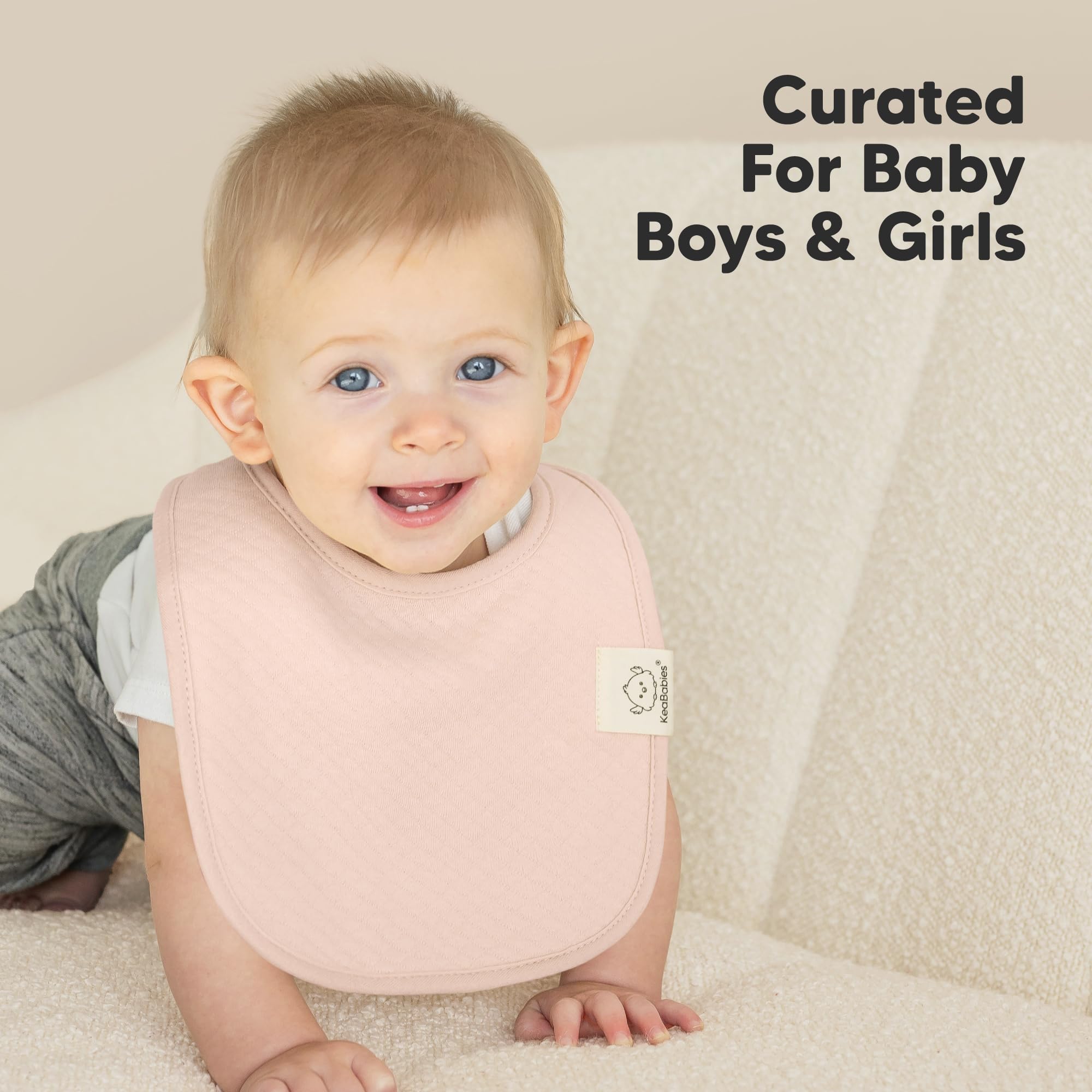 KeaBabies Dawn large coverage bib on baby torso during spills.