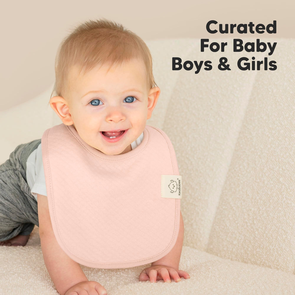 KeaBabies Dawn large coverage bib on baby torso during spills.