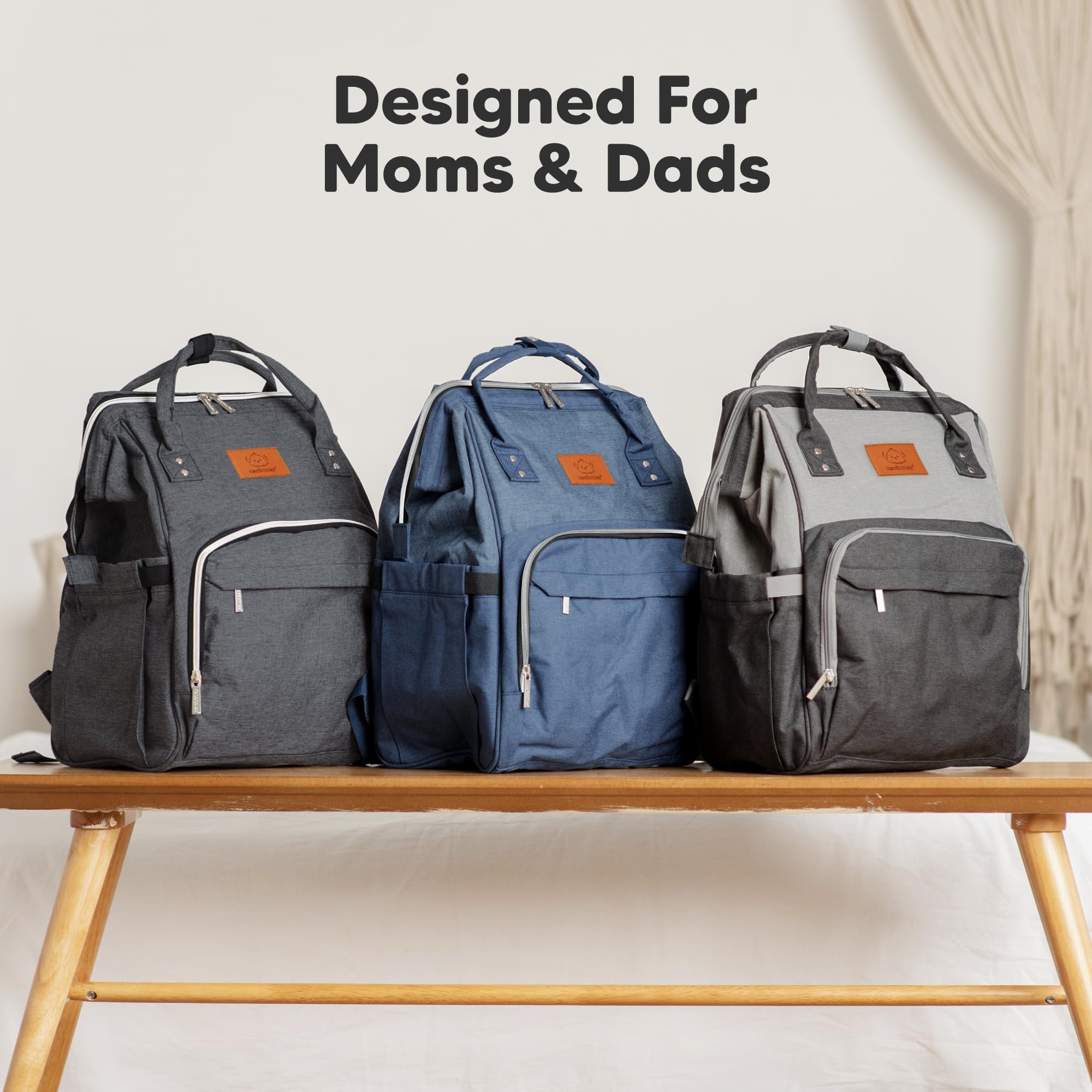 KeaBabies black travel diaper bag complements outfits during trips.