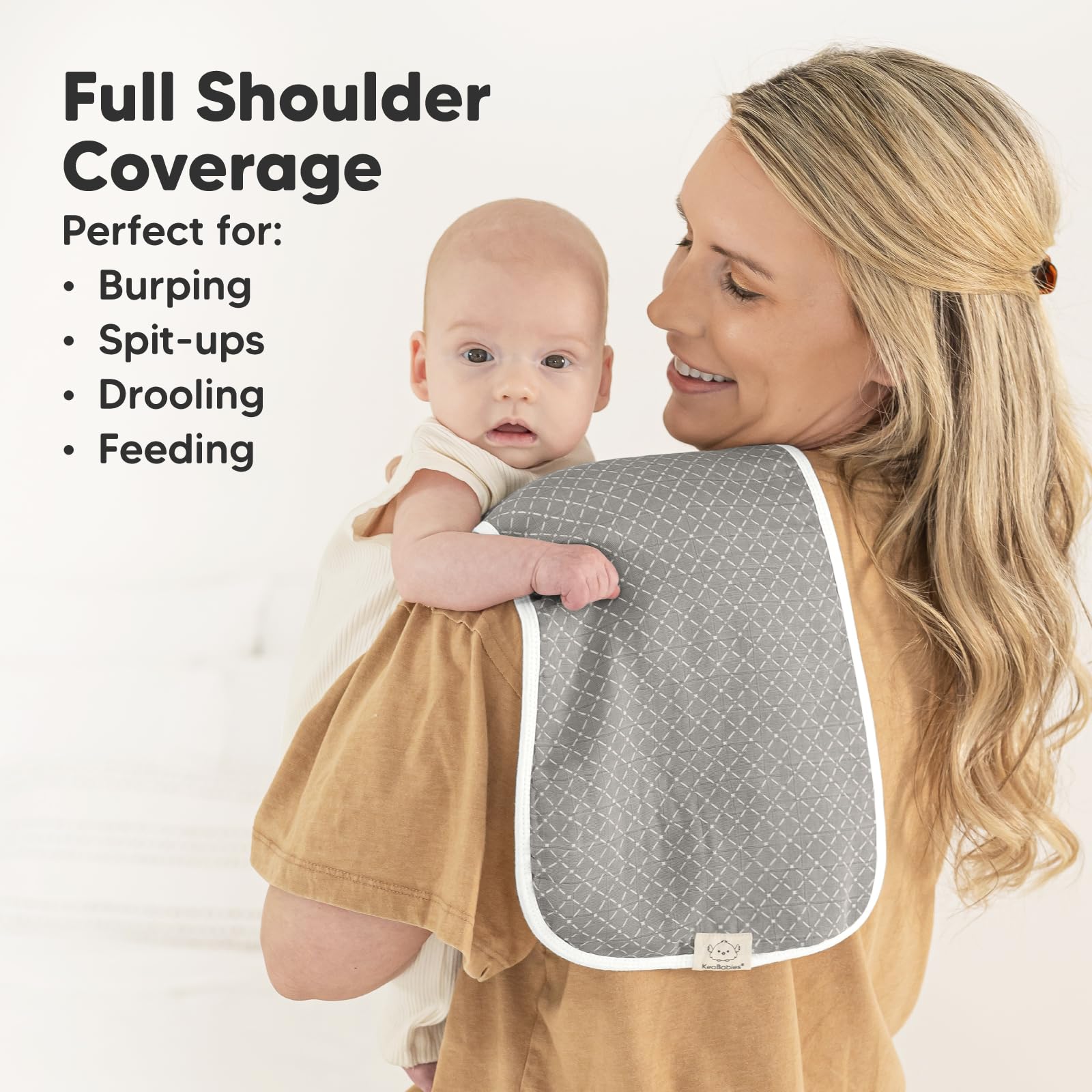 KeaBabies figure-8-design burp cloth on shoulder, secure fit helps prevent slips.
