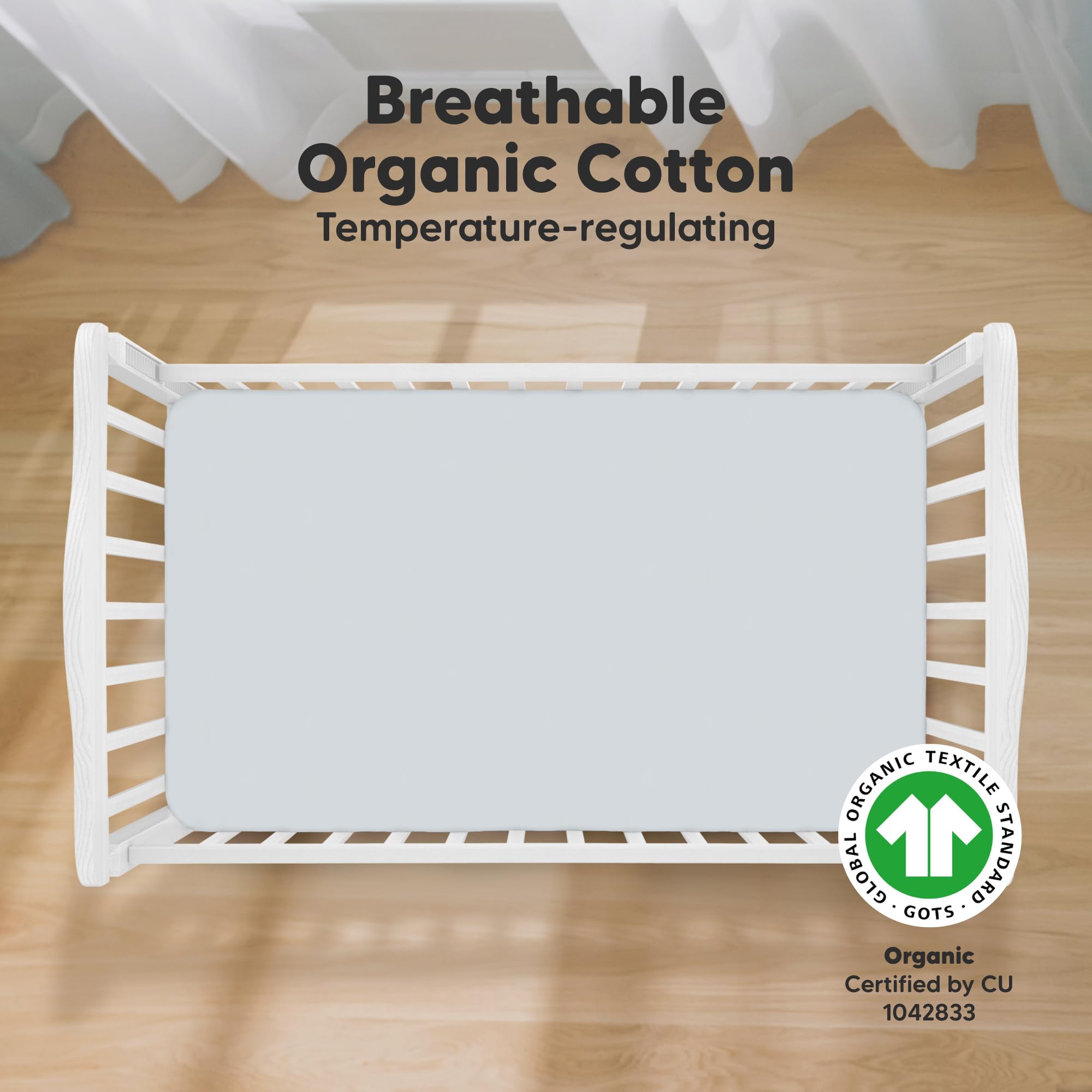 KeaBabies hazy print crib sheet on standard mattress showcasing snugfit stretch.